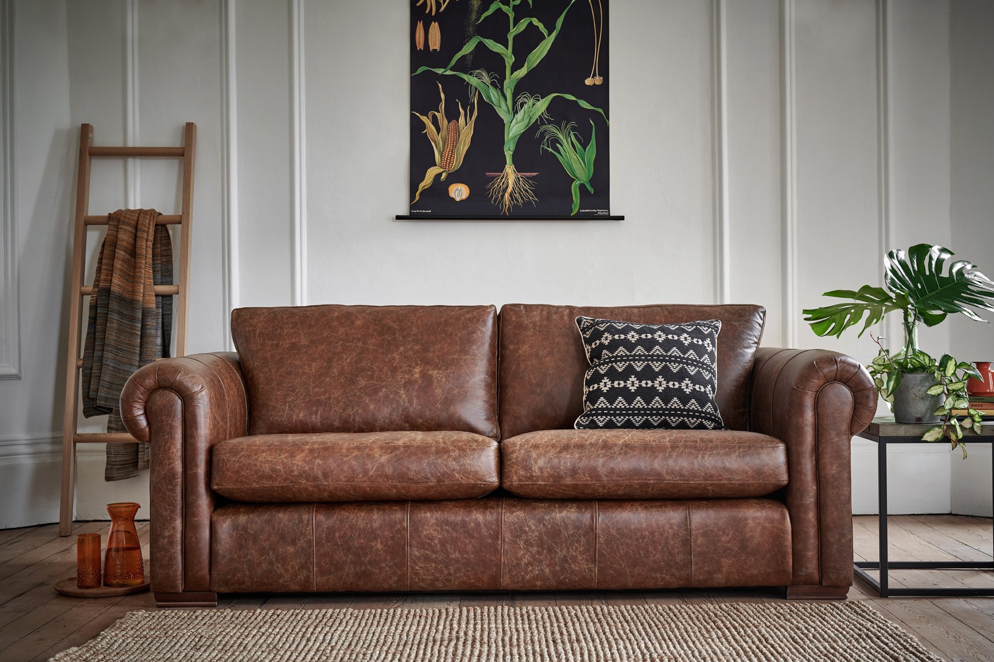 leather dark grey sofa with red cushions