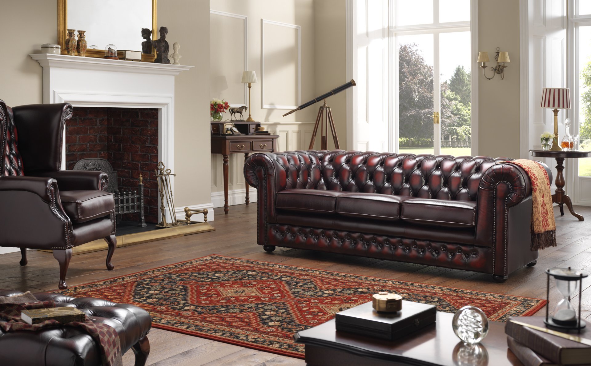 living room with leather chesterfield sofa